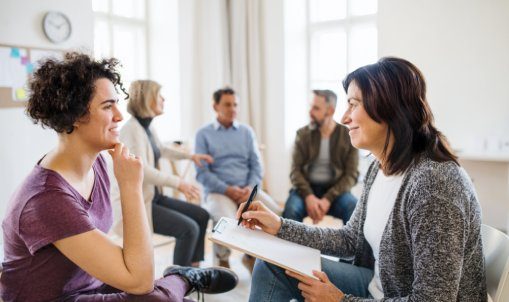 happy counselor during therapy session
